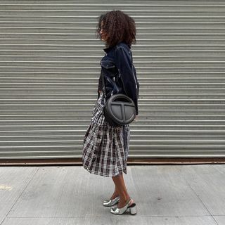 @naomielizee wearing plaid skirt and denim jacket