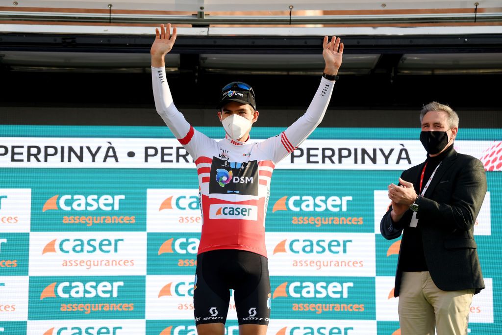 PERPIGNAN FRANCE MARCH 22 Jonas Iversby Hvideberg of Norway and Team DSM celebrates winning the red mountain jersey in the podium ceremony after the 101st Volta Ciclista a Catalunya 2022 Stage 2 a 2024km stage from LEscala to Perpignan VoltaCatalunya101 WorldTour on March 22 2022 in Perpignan France Photo by David RamosGetty Images