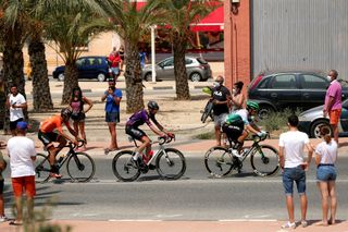 Ander Okamika (Burgos-BH), Aritz Bagues (Caja Rural-Seguros RGA) and Mikel Iturria (Euskaltel-Euskadi) ride through the crowds at the 2021 Vuelta a España