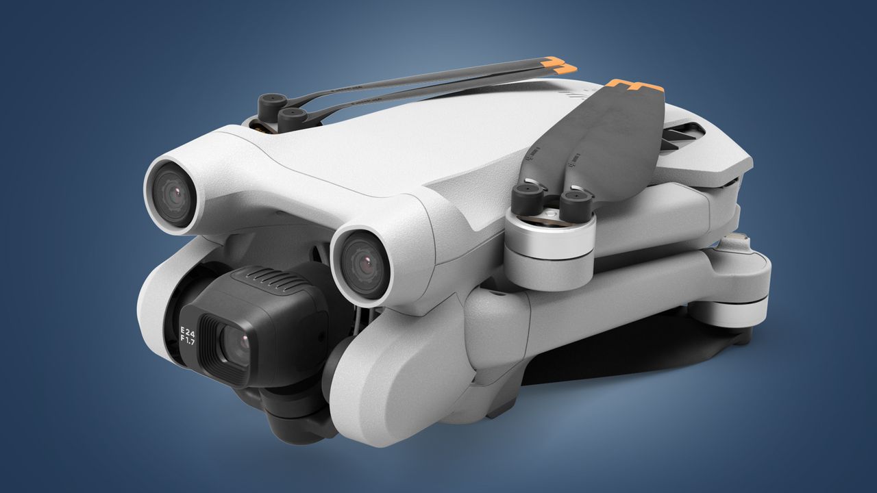 The DJI Mini 3 Pro drone on a blue background