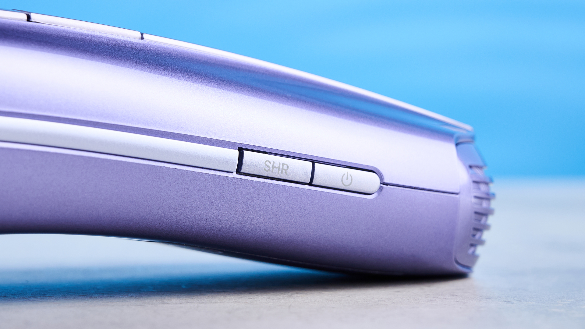 ULike Air 10 IPL machine photographed in front of a blue background.