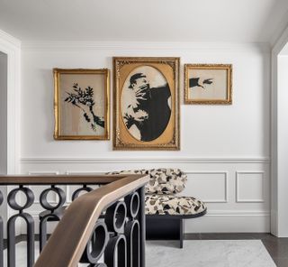 Banksy triptych in the staircase landing at House of Walpole London interiors