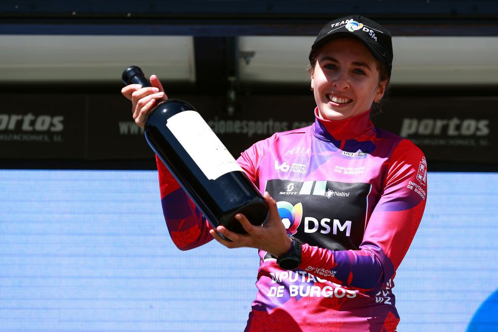LAGUNAS DE NEILA SPAIN MAY 22 Juliette Labous of France and Team DSM celebrates at podium as Pink Leader Jersey winner during the 7th Vuelta a Burgos Feminas 2022 Stage 4 a 1251km stage from Covarrubias to Lagunas de Neila 1867m VueltaBurgos BurgosFem UCIWWT on May 22 2022 in Lagunas de Neila Spain Photo by Gonzalo Arroyo MorenoGetty Images