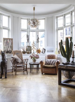 sitting room with bay window and vintage chairs