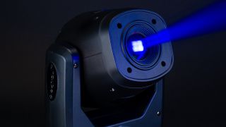 The Aero Mini Moving Light Fixture shining a blue and yellow beam of light. 