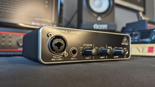 A Behringer UMC22 audio interface on a desktop