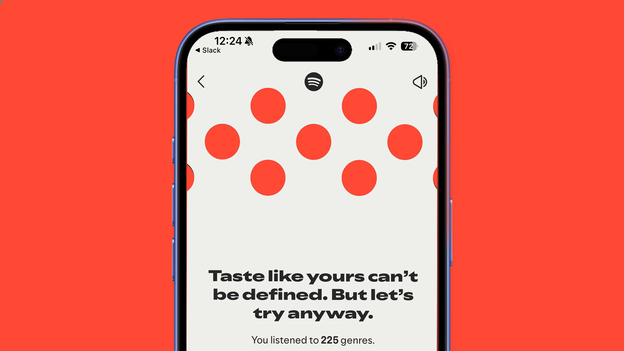 A phone on a red background showing the Spotify web player