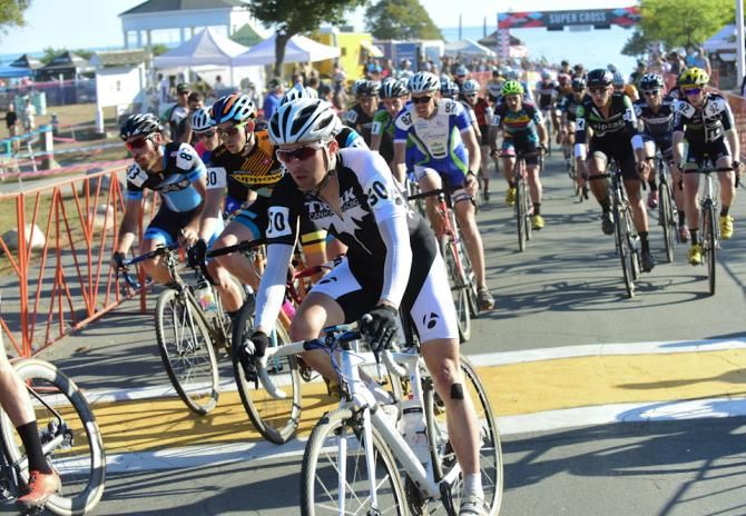 The Elite Men head off the pavement after the start