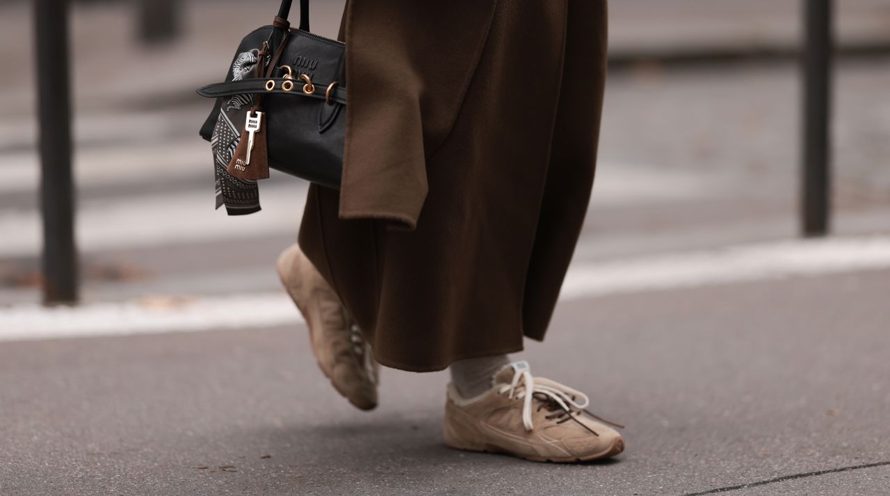 model wearing suede sneakers