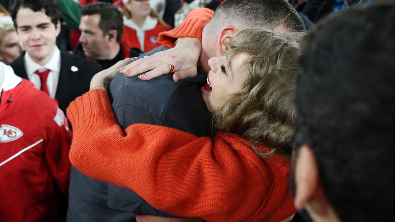 Travis Kelce #87 of the Kansas City Chiefs celebrates with Taylor Swift after a 17-10 victory against the Baltimore Ravens in the AFC Championship Game at M&amp;T Bank Stadium on January 28, 2024 in Baltimore, Maryland