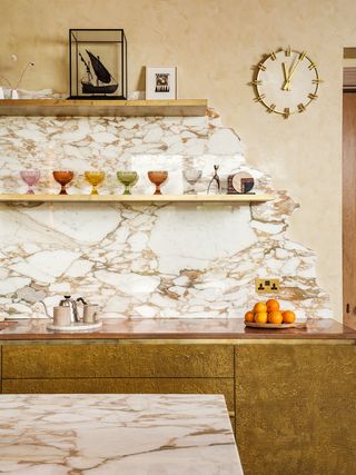 tan kitchen with marble backsplash