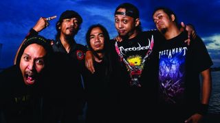 Burgerkill standing together near the sea