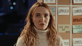 Chloe Fineman in sweater talking about celebrity impressions for Saturday Night Live BTS short