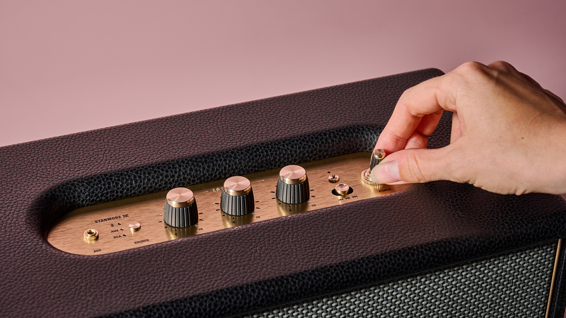 Person turning control knob on the Marshall Stanmore IV