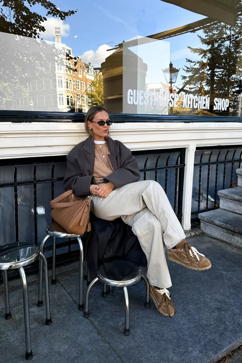 influencer Tine Van Cauwenberghe wearing a pair of brown prada trainers