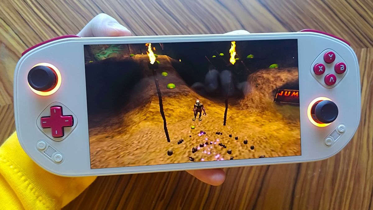 Mangmi Pocket Max with Oddworld: Munch's Odyssey gameplay on screen featuring Abe.