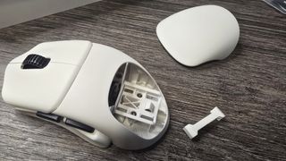 Orbital Pathfinder gaming mouse with various attachments.
