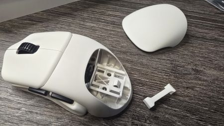 Orbital Pathfinder gaming mouse with various attachments.