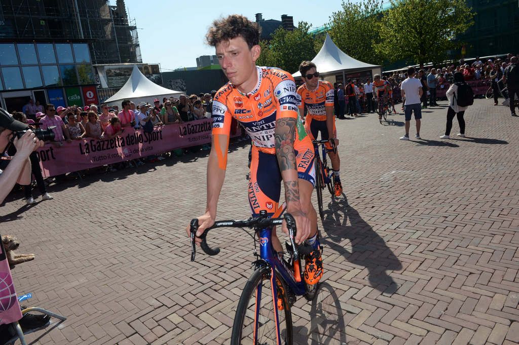 Gianfranco Zilioli rides to sign on
