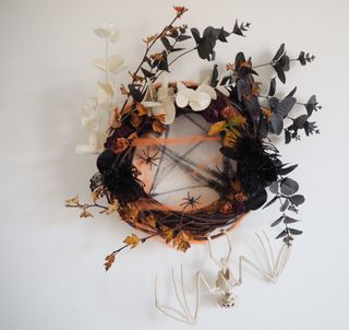 halloween wreath diy with faux stems, real stems, spiders, fake webs, skeleton bat