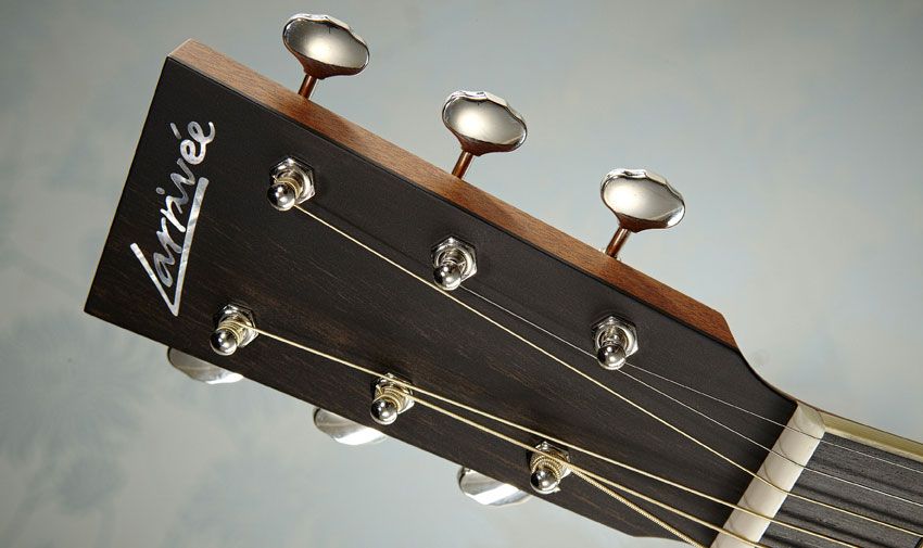 The headstock is simplistic with just an inlaid mother-of-pearl logo and open-backed Gotoh tuners