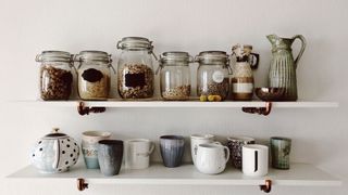 Ways to save space in your kitchen: Image shows jars in kitchen