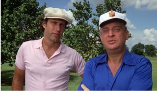 Caddyshack Chevy Chase Rodney Dangerfield admiring a golf shot with a joke