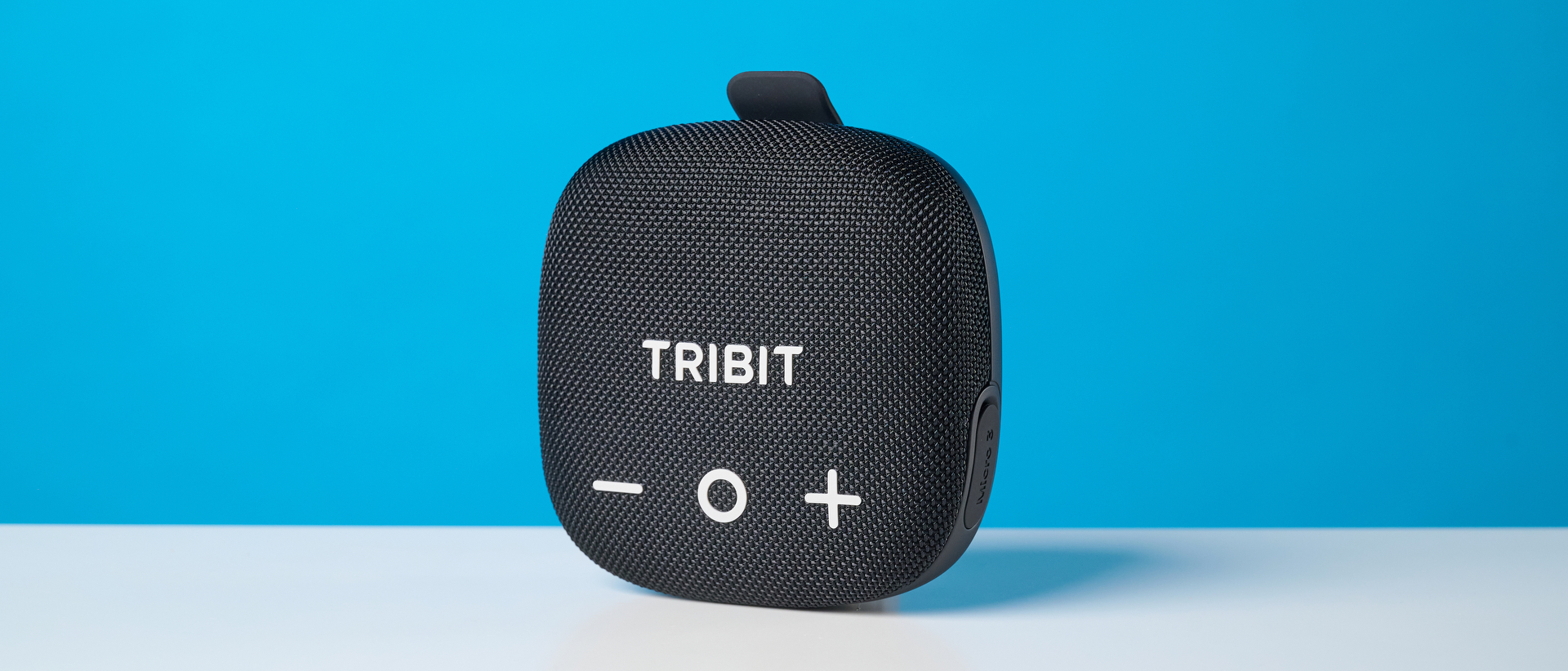 Tribit StormBox Micro 3 in black photographed in front of a blue background