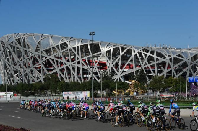 The birds nest serves as a backdrop for the Tour of Beijing
