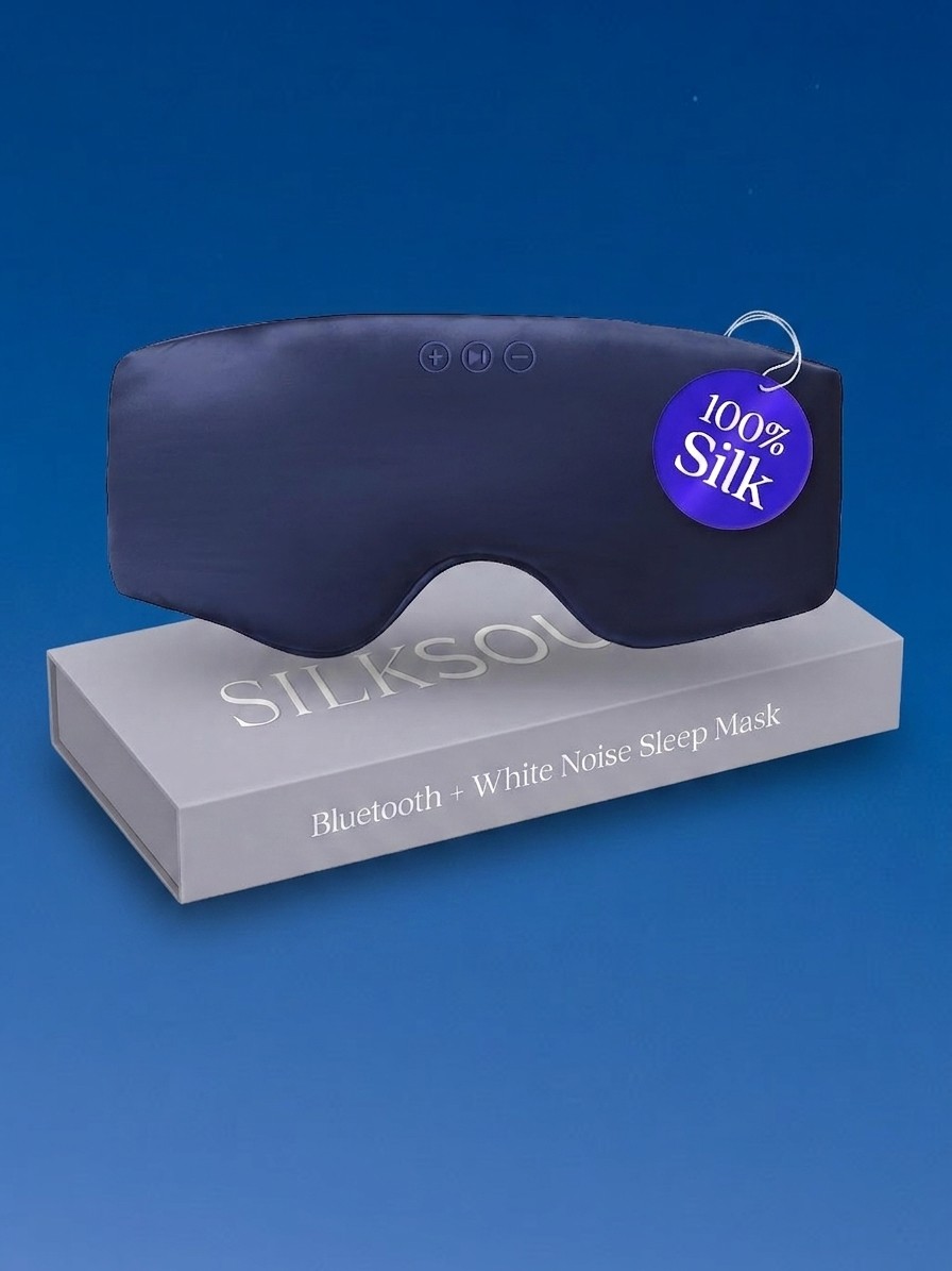 A SilkSound Bluetooth Sleep Mask and box against a blue sky background, edited by Gemini