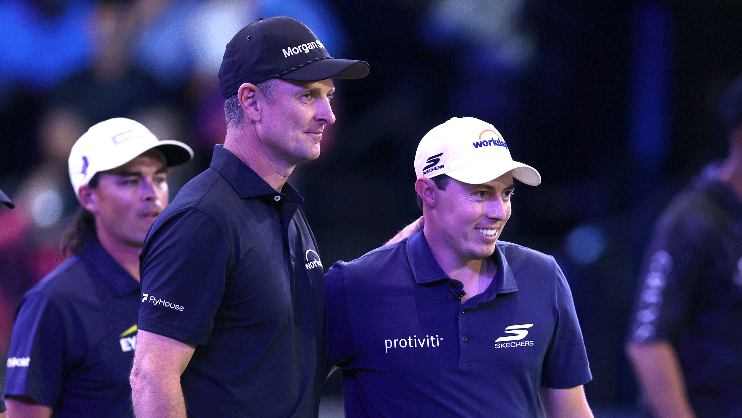 Justin Rose and Matt Fitzpatrick put an arm round the other during a TGL match in 2026