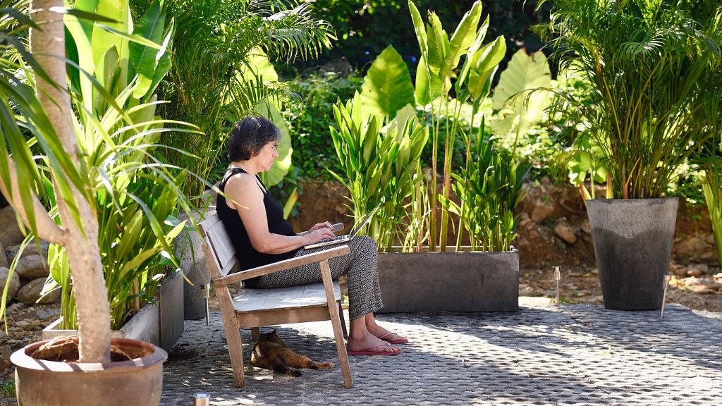 woman working outdoors in garden 