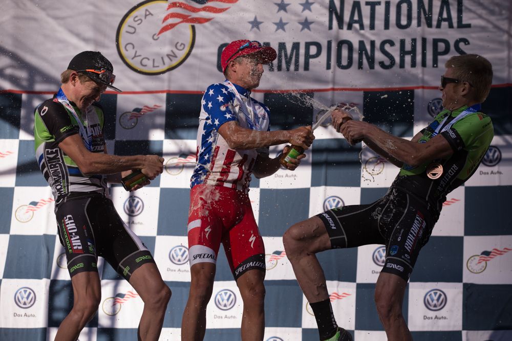 The pro men's podium of Howard Grotts, Keegan Swenson and Alexander Grant celebrated with beer