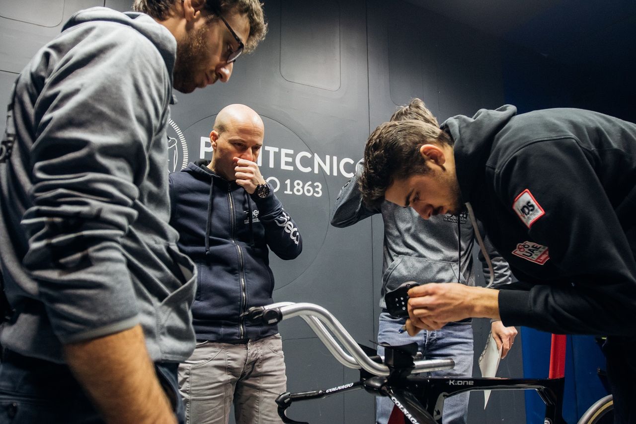 Mechanics and staff dial in a bike