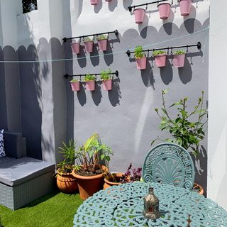 garden with hanging herb garden and plant pots