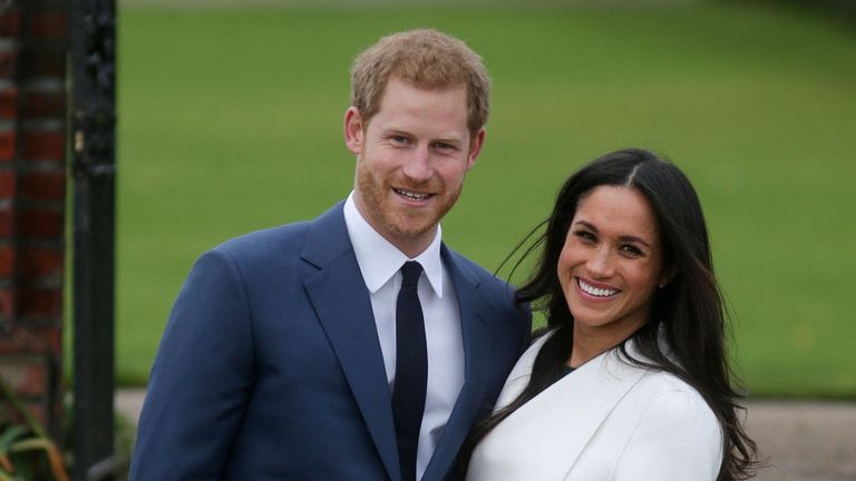 Prince Harry and his fiancée US actress Meghan Markle pose for a photograph in the Sunken Garden at Kensington Palace