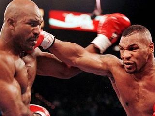 Mike Tyson (r) in a 1996 fight with Evander Holyfield.