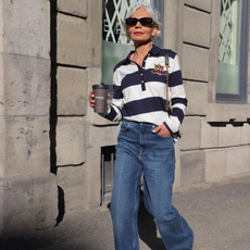 infleuncer wearing a rugby top and flared jeans