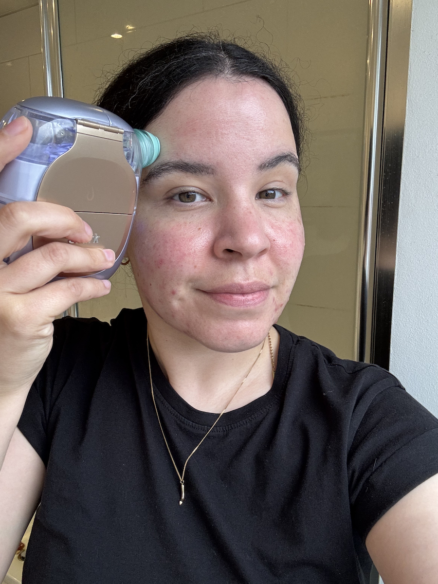 Mica Ricketts using the Shark Beauty Facial ProGlow + DePuffi hydrate the skin