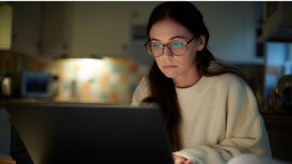 A person looking at a computer.