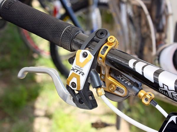 Adam Craig's (Rabobank-Giant Off-Road Team) controls get the gold treatment courtesy of Shimano's Yumeya hop-up parts.