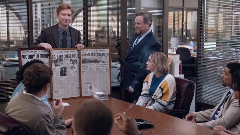 Ned showing the staff members old newspapers in The Paper