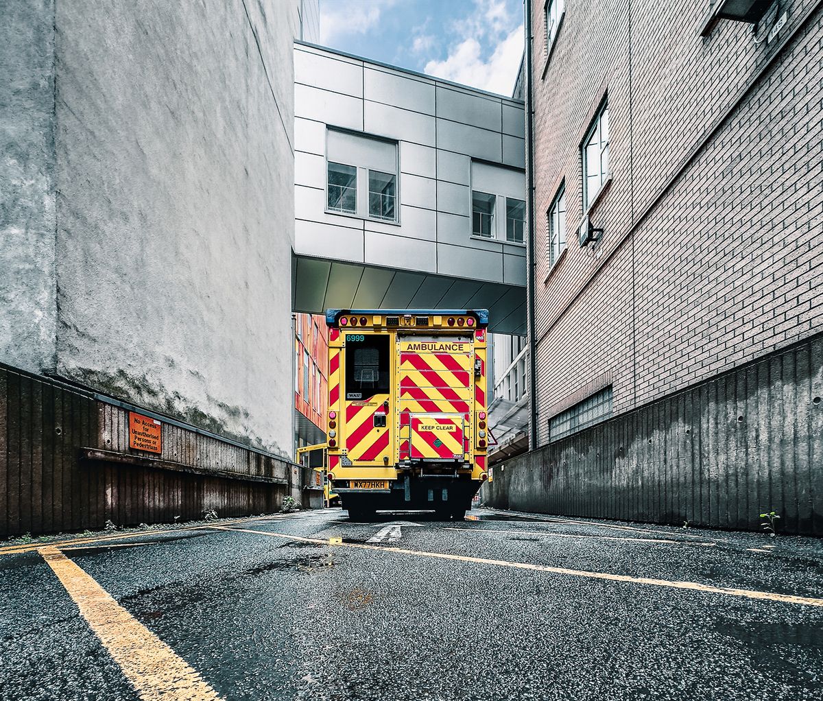 Ambulance car standing in front of a part of the BRI hospital building