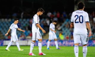 Alvaro Morata, Gonzalo Higuain and Jose Maria Callejon of Real Madrid leave the pitch defeated at the end of the la Liga match between Getafe and Real Madrid at Coliseum Alfonso Perez on August 26, 2012 in Getafe, Spain.