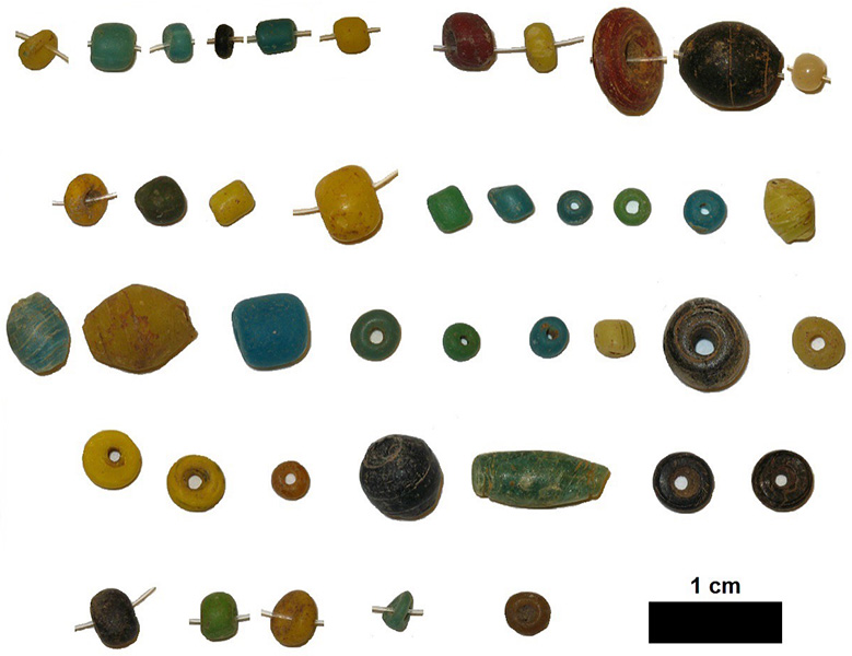 A selection of glass beads in various shapes, sizes, and colors