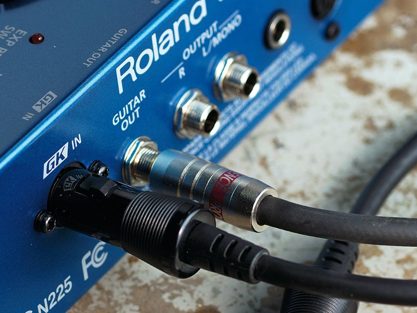 The Guitar Out means that you can use separate amps for the guitar and synth sounds.