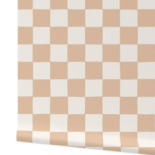 A white and beige checkerboard peel and-stick wallpaper roll