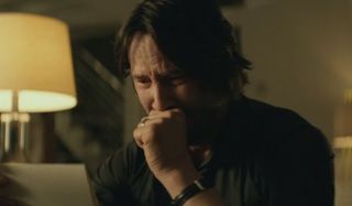 Keanu Reeves as John Wick crying