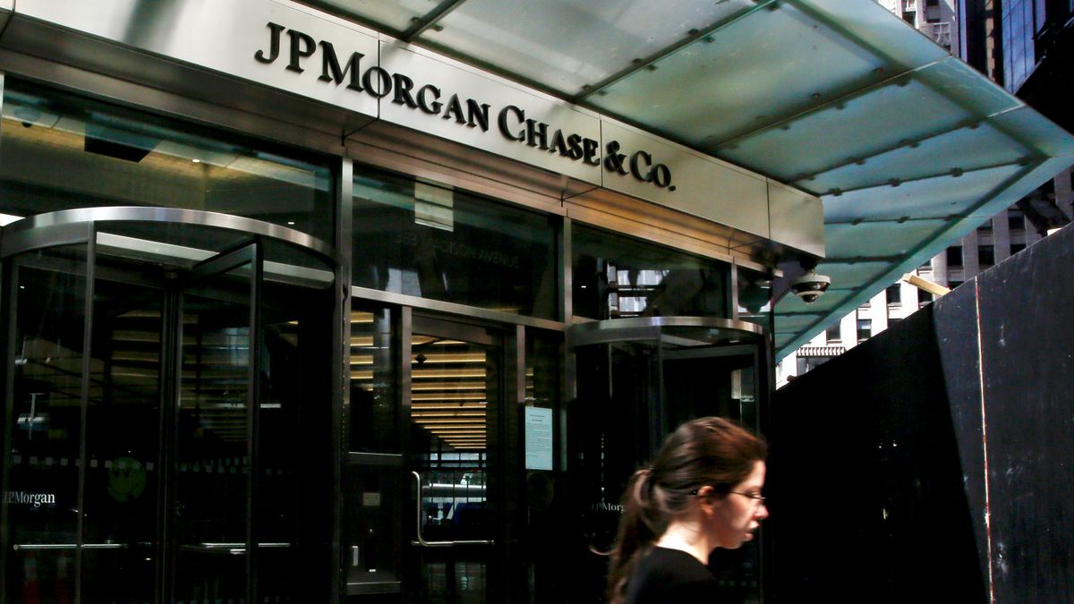 JPMorgan Chase logo above an entrance of two revolving doors at the bank&#039;s New York offices