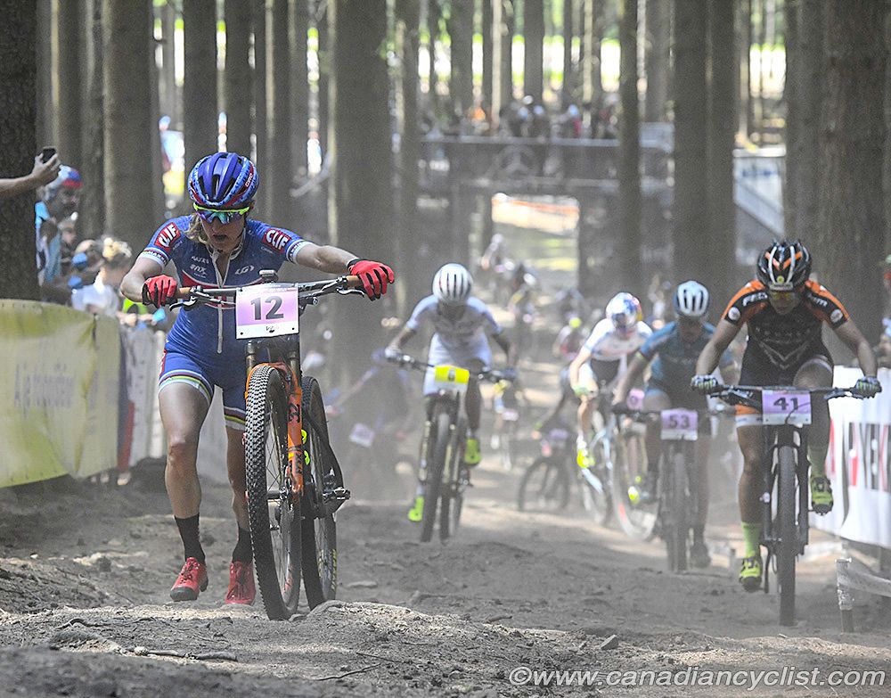 Catharine Pendrel (Clif Pro Team) walking up the climb after a slow leak flat